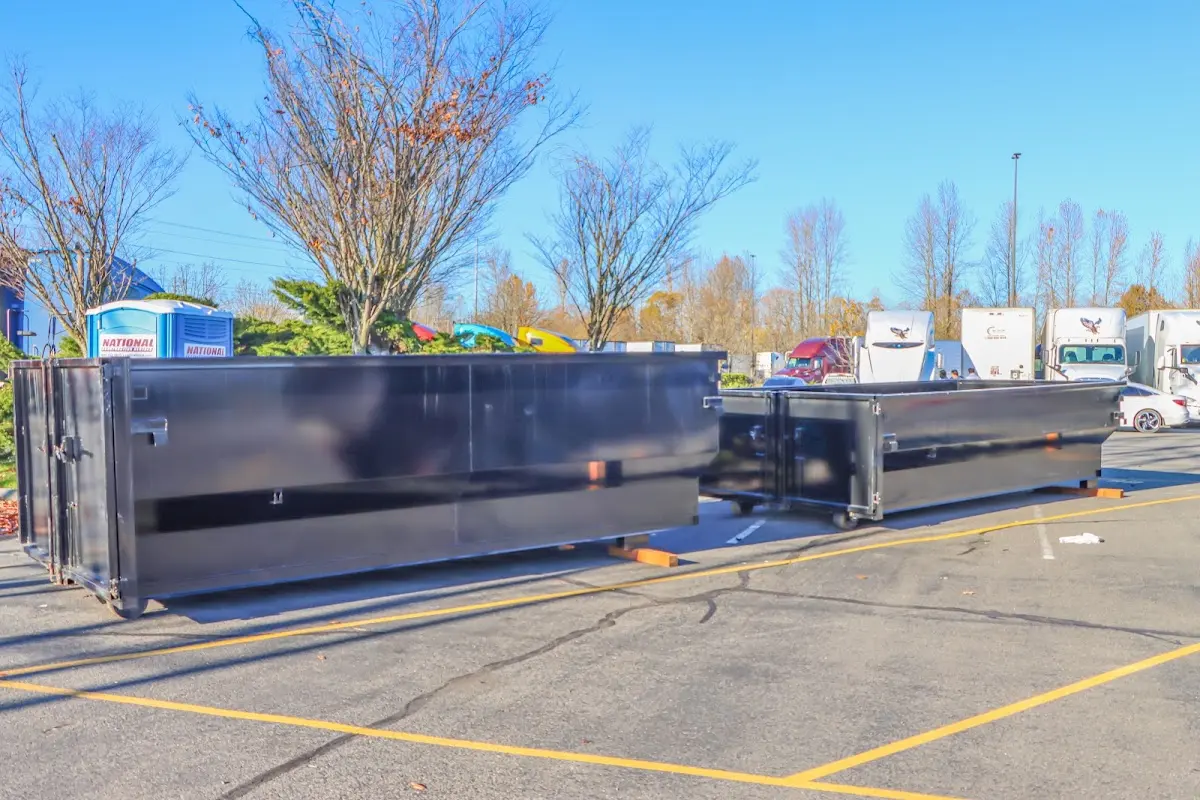 Professional dumpster rental service with roll-off container on residential driveway in Shawano