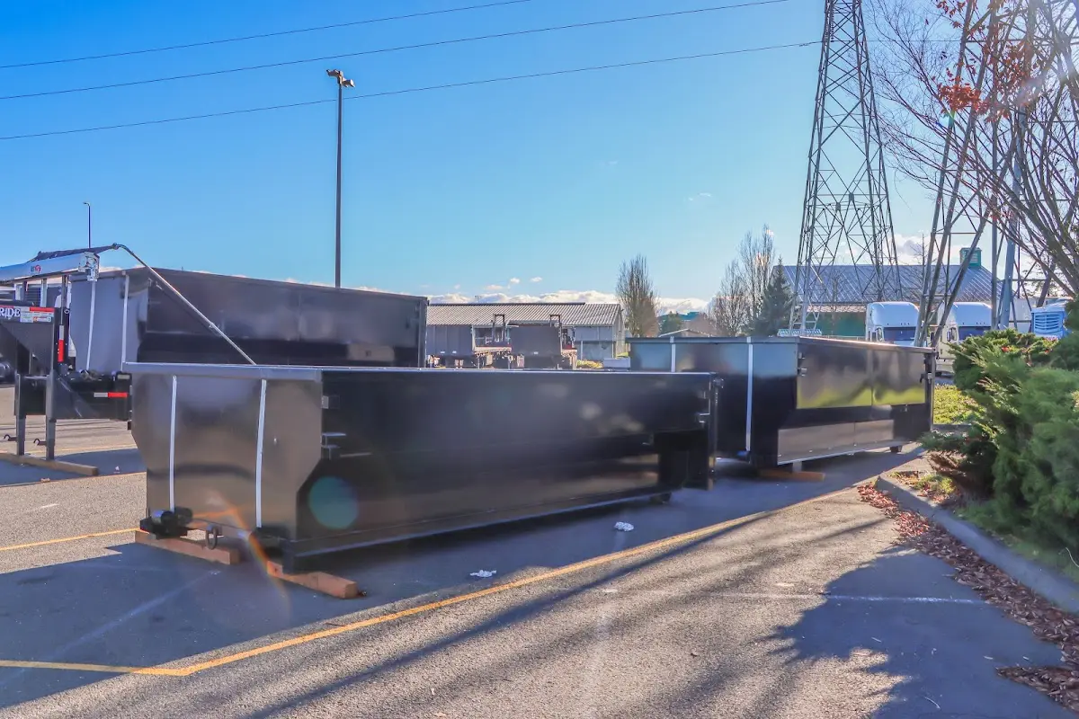 Roll-off dumpster ready for waste disposal at job site for Concrete Dumpster Rental in Shawano